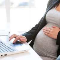 A pregant woman working