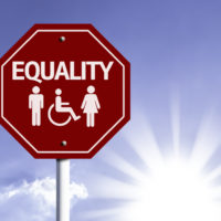 A red stop sign that reads equality