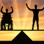 diable man in wheelchair and a man standing