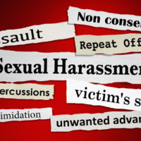 the red Sexual Harassment sign