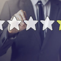 Businessman drawing one star in the air Businessman drawing one star in the air