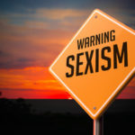 warning sign that reads sexism warning sign that reads sexism