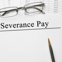 paper that reads Severance Pay paper that reads Severance Pay