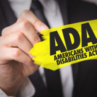 yellow ADA sign yellow ADA sign