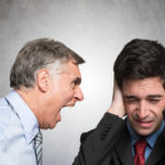 Angry businessman shouting at employee Angry businessman shouting at employee