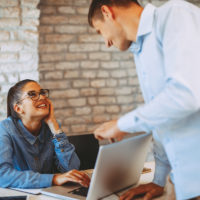 Man and woman flirting in the office