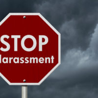 stop sign that says stop harassment