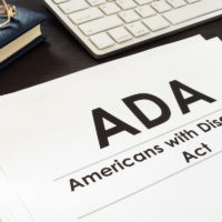 ADA documents, glasses, keyboard on desk ADA documents, glasses, keyboard on desk