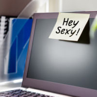 Computer screen with hey sexy note - capturing a hostile work environment Computer screen with hey sexy note - capturing a hostile work environment