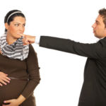 Manager pointing at a pregnant employee to highlight pregnancy discrimination can happen, such as in the form of claiming no light duty work available Manager pointing at a pregnant employee to highlight pregnancy discrimination can happen, such as in the form of claiming no light duty work available