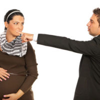 Manager pointing at a pregnant employee to highlight pregnancy discrimination can happen, such as in the form of claiming no light duty work available Manager pointing at a pregnant employee to highlight pregnancy discrimination can happen, such as in the form of claiming no light duty work available