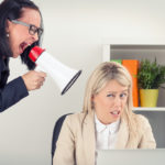 Boss yelling at employee on megaphone Boss yelling at employee on megaphone