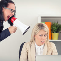 Boss yelling at employee on megaphone
