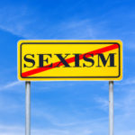 Yellow sign that reads sexism Yellow sign that reads sexism