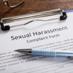 Sexual Harassment Complaint Form With Pen and glasses on desk Sexual Harassment Complaint Form With Pen and glasses on desk
