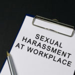 Clipboard that reads sexual harassment at workplace Clipboard that reads sexual harassment at workplace