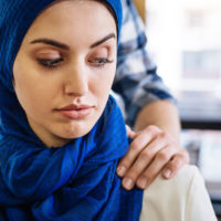 Muslim woman touched at work by coworker