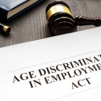 Age Discrimination in Employment Act and gavel in a court.