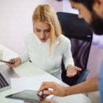 Female employee complaining to boss Female employee complaining to boss