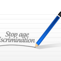 stop age discrimination written by pencil on pad