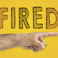 HR, firing employee concept. HR representative pointing at door