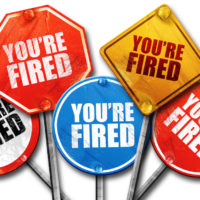multiple varied road signs reading you're fired