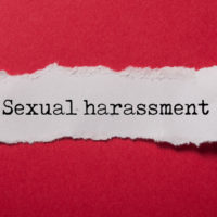 sexual harassment torn paper closeup