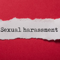 sexual harassment torn paper closeup sexual harassment torn paper closeup
