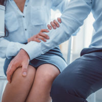 man sexually assaults woman with hand on leg man sexually assaults woman with hand on leg