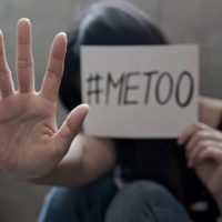woman with #metoo sign stop sexual harassment