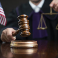 Judge during the trial with the gavel. Judge during the trial with the gavel.