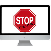Racism stop sign. Modern computer
