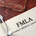 Page with FMLA family medical leave act on a table.