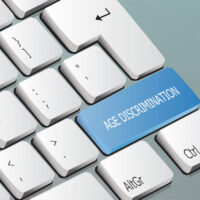 age discrimination written on the keyboard button