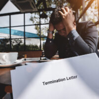 Termination of Employment and layoff concept, Stressed businessman feeling down after received Termination