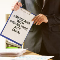 Conceptual hand written text showing Americans with Disabilities Act (ADA)