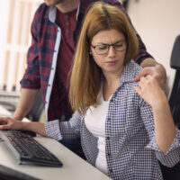 Woman being sexually harassed at work Woman being sexually harassed at work