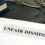 Unfair dismissal documents and pen in an office.