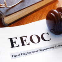 EEOC equal employment opportunity commission report and gavel. EEOC equal employment opportunity commission report and gavel.