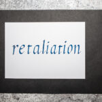 Handwritten word Retaliation. An eye for an eye concept. Italic script calligraphy. Handwritten word Retaliation. An eye for an eye concept. Italic script calligraphy.