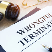 Documents about wrongful termination and gavel.