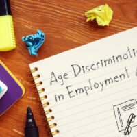 Career concept meaning Age Discrimination in Employment Act ADEA with sign on the page.