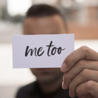 man showing a note with the text me too man showing a note with the text me too