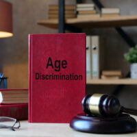 Age Discrimination is shown on the conceptual business photo