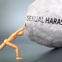 Sexual harassment and painful human condition, pictured as a wooden human figure pushing heavy weight to show how hard it can be to deal with Sexual harassment in human life, 3d illustration