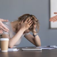 Stressed businesswoman suffering from unfair gender discriminati