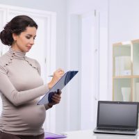 pregnant business woman in the office