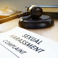 Sexual harassment complaint and gavel on a desk. Sexual harassment complaint and gavel on a desk.