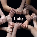 African and caucasian hands gesturing on gray studio background, tolerance and equality concept