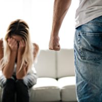 Man beating up his wife illustrating domestic violence Man beating up his wife illustrating domestic violence
